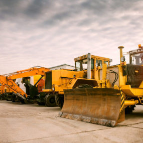 a row of large construction equipment