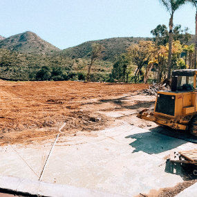 land under development with construction equipment